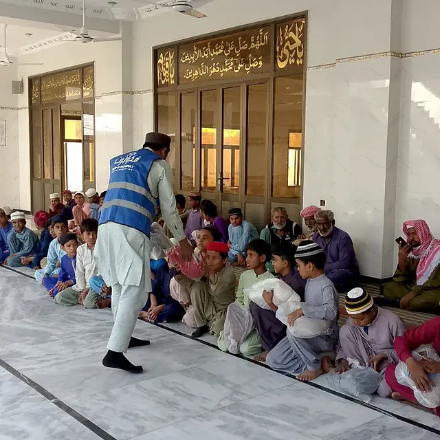 Children Receiving Packs at the Masjid