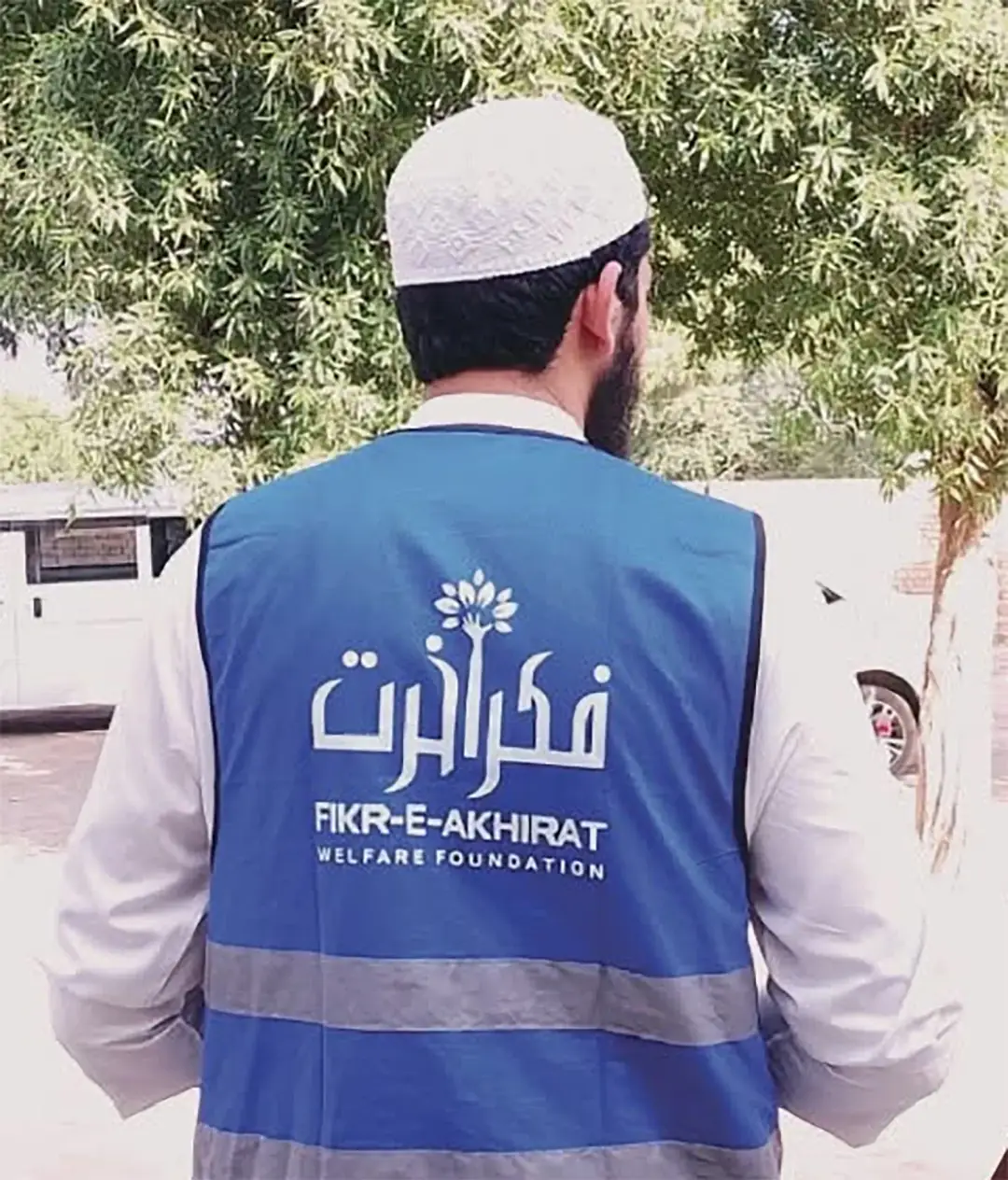 Fikr-e-Akhirat Welfare Foundation volunteer wearing the Foundation's blue vest